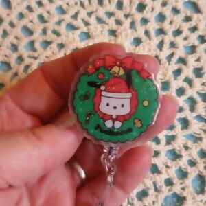 Hello Kitty Christmas Wreath Badge Reel